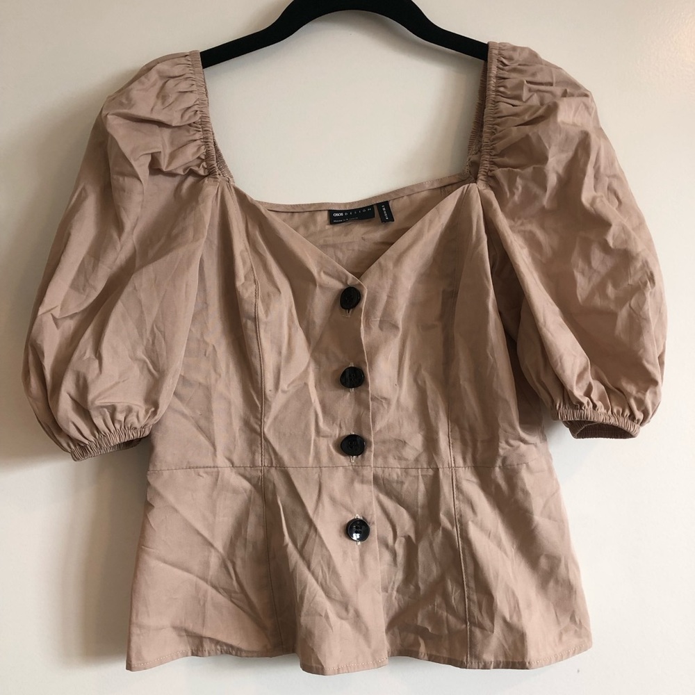 ASOS design tan blouse with puff sleeves and black button details.